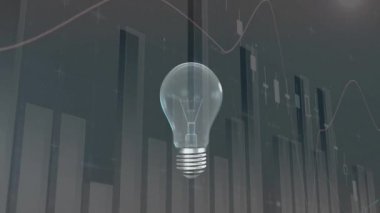 Dijital olarak üretilen ampul ün yanarak ve farklı grafiklere sahip gri bir arka plan