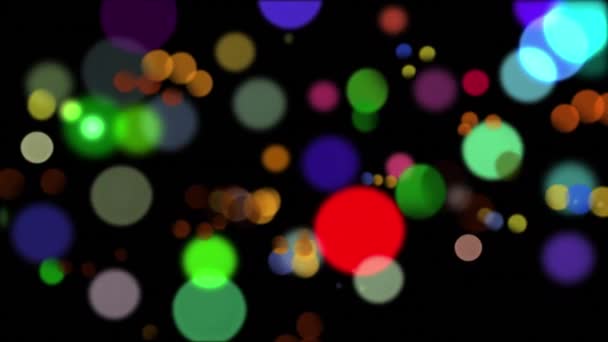 Animation générée numériquement de lumières bokeh colorées se déplaçant à l'écran sur un fond noir .