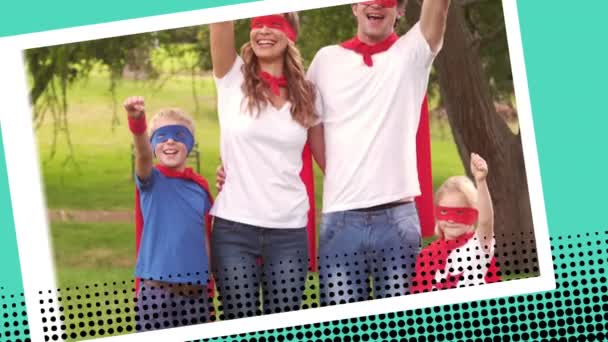 一个白人家庭的数字动画 两个孩子穿着超级英雄的服装 同时举起他们的拳头在公园在数码照片边界效果 — 图库视频影像