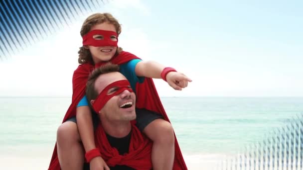 高加索的父亲带着他的女儿在海滩附近 两人都穿着超级英雄的服装 虚线板的数字动画在前景中可见 — 图库视频影像