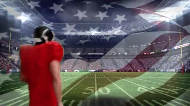 一位美国足球运动员在体育场庆祝胜利的数字图像 我们的国旗在前方飘扬 — 图库视频影像