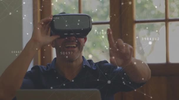 Digital Composite Caucasian Man Wearing Virtual Reality Headset Having Fun — Stock Video