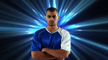 Mavi parlayan ışıklar arka plan ile kollarını geçen bir Afrikalı-Amerikalı atlet dijital kompozit