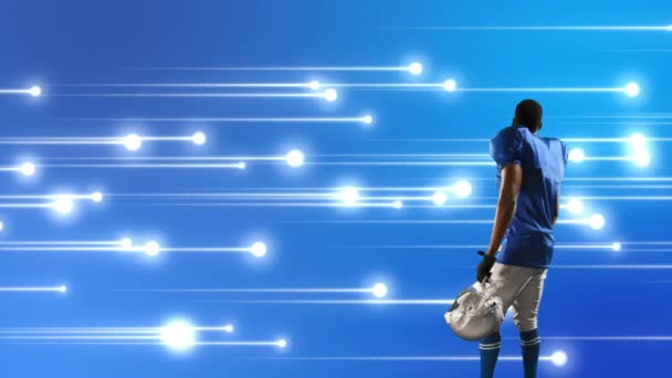 Цифровая Композиция Афроамериканского Футболиста Светящимися Огнями Синем Фоне — стоковое видео