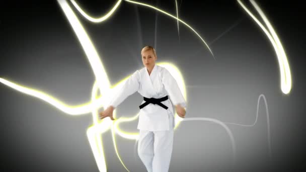 Digital Composite Caucasian Woman Doing Karate While Glowing Strings Move — Stock Video