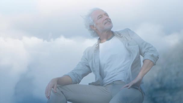 Digital Composite Old Caucasian Man Sitting Rock Background Sky Clouds — Stock Video