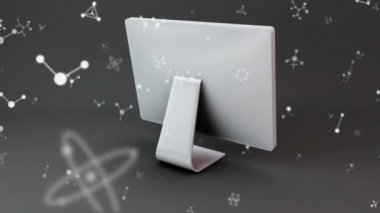 Beyaz monitörün dönen ve molekül modellerinin gri arka plana karşı hareket etmesi için dijital animasyon