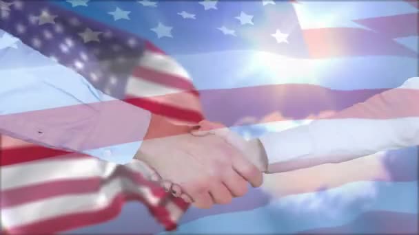 Digital Composite Two Hands Shaking While Background Shows American Flag — Stock Video
