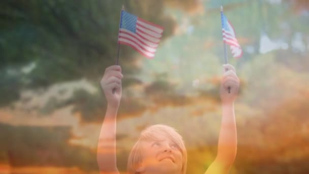 Digital Composite Caucasian Child Holding Out Two American Flags Outdoors — Stock Video