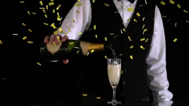 Digital Composite Caucasian Waiter Pouring Champagne Glass While Gold Confetti — ストック動画