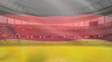 Bir spor stadyumu önünde bir üfleme Alman bayrağı animasyon
