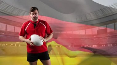Kafkas bir erkek rugby oyuncusunun top alavurup işaret etmesi ve arka planda Alman bayrağı ve stadyum üfleme ile kameraya bakması animasyonu
