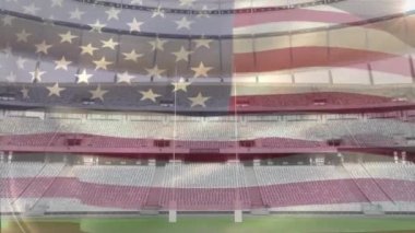 Bir spor stadyumu önünde bir üfleme Amerikan bayrağı animasyon