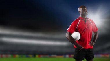 Bir Top tutan ve arka planda ışıklandırılmış stadyum ile etrafa bakan bir Afrikalı-Amerikalı erkek rugby oyuncusu Animasyon