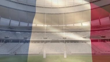 Bir spor stadyumu önünde bir üfleme Fransız bayrağı animasyon
