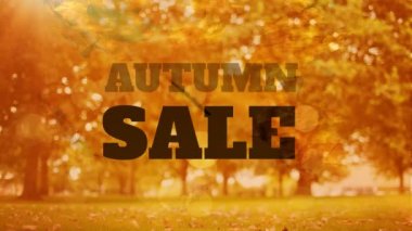 Arka planda şehir parkı düşen yaprakları ile büyük harflerle kelime Sonbahar Satılık Animasyon