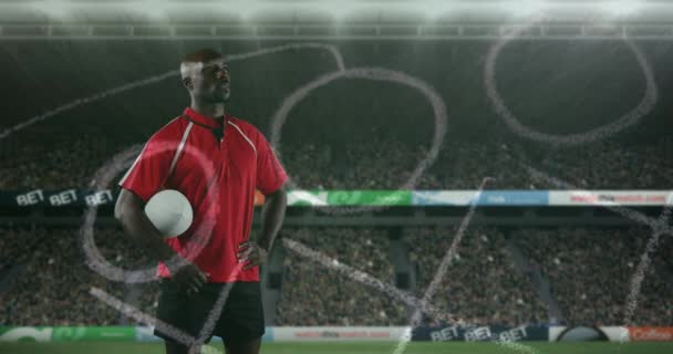 Animation Joueur Afro Américain Rugby Debout Tenant Une Balle Sous — Video