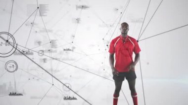 Bir Afro-Amerikan erkek rugby oyuncusu kollarını çapraz ve beyaz arka planda görünen veri ile kameraya bakarak ayakta Animasyon