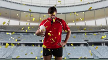 Bir top ile oynayan ve altın konfeti düşen ve arka planda bir spor stadyumu ile kameraya bakarak bir Kafkas erkek rugby oyuncusu animasyon