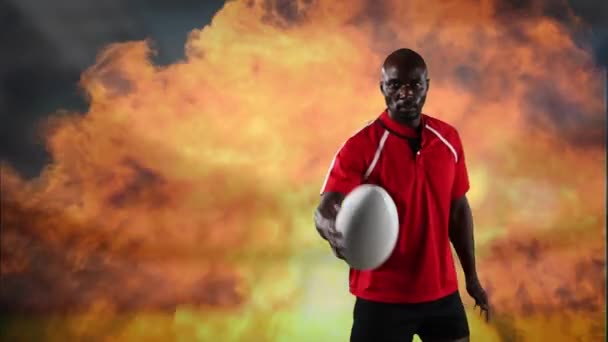 一个非裔美国男子橄榄球运动员玩球 并期待在背景中的火焰相机的动画 — 图库视频影像