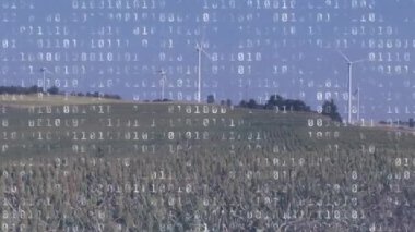 Rüzgar türbinlerinin kırsal bir ufukta mavi gökyüzüne doğru tornalama animasyonu, ön planda beyaz dolguda değişen ikili kodlama ile