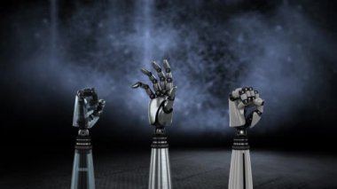 Üç metal robot elin gri bulanık bir arka plan üzerinde tornalama ve amcacı yumruğun animasyonu