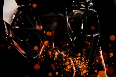 Amerikan Futbol Oyuncusu havai fişek patlama karşı pırıl pırıl arka plan