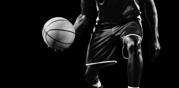 Basketball player isolated on black background 