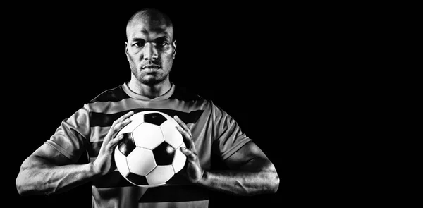 Focused Soccer Player Isolated Black Background Royalty Free Stock Images