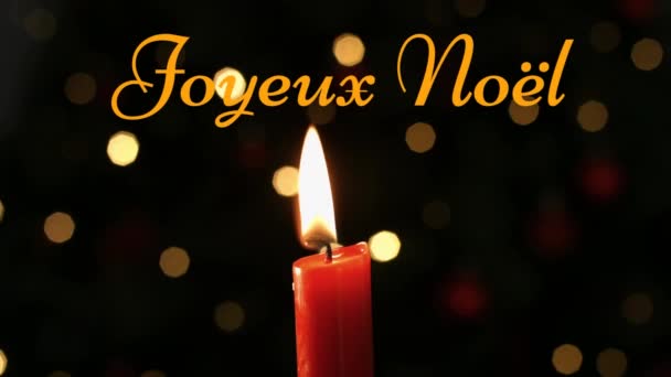 Анимация Слов Joyeux Noel Написанных Оранжевым Зажженной Свечой Мерцающими Огнями — стоковое видео