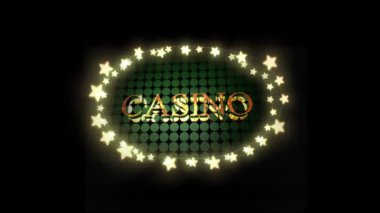 Kumarhane kelimesinin animasyonu altın harflerle yeşil noktalar üzerinde oval çerçevede parlayan yıldız şeklinde siyah arka planda peri ışıkları şeklinde.