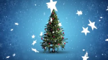 Mavi arka planda dönen Noel ağacı ve düşen yıldızların animasyonu