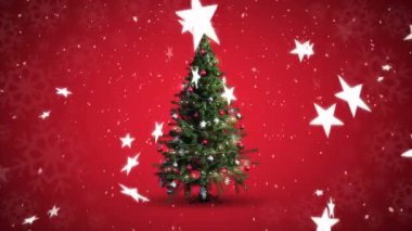 Kırmızı zemin üzerinde dönen Noel ağacı ve düşen yıldızların animasyonu