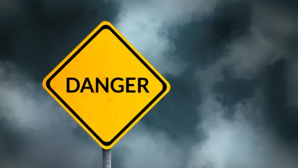 Animation of the word Danger written in black letters on a yellow road sign with spooky clouds in the background — Stock Footage Animation Word Danger Written Black Letters Yellow Road Sign Spooky Video Clip