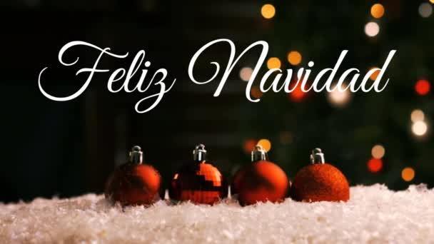 Feliz Navidad という言葉のアニメーションは 背景に赤いクリスマスの泡とちらつきの光に白い文字で書かれています — ストック動画