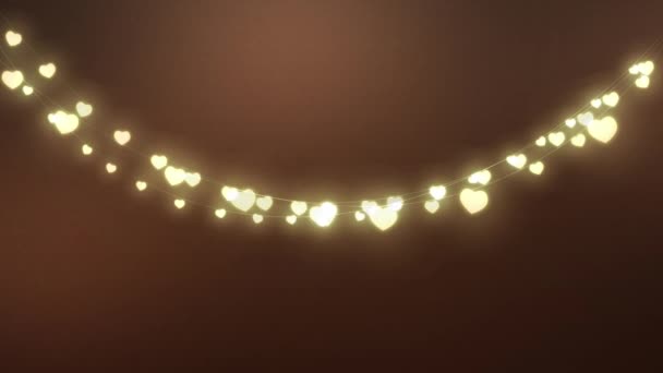 用一串串闪烁着橙色光芒的心形神灯作圣诞装饰的动画 — 图库视频影像