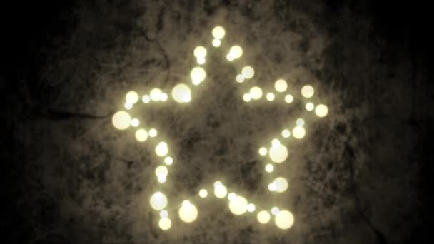 在灰色的背景上 用一颗闪烁着仙女光芒的星星来动画圣诞装饰品 — 图库视频影像