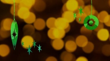 Mutlu Noeller, beyaz harflerle yazıldı. Noel mücevherleri yeşille çizildi. Sarı ışıkların önünde.