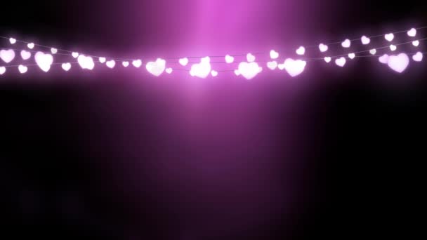 粉色背景下一串发光心形神灯圣诞装饰品的动画制作 — 图库视频影像