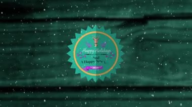 Animation of the words Happy Holidays and A Happy New Year 2020 written on a round sawtooth shaped green label decorated with a reindeer head and purple flowers with falling snow against a green wooden background