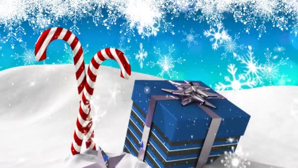 降雪的动画 蓝色的圣诞礼物和两个蓝色背景的雪糖手杖 — 图库视频影像