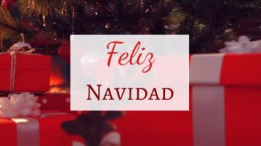 Feliz Navidad 'ın Noel ağacının üzerindeki beyaz tabelaya kırmızı harflerle yazıp arka planda sunduğu animasyon.