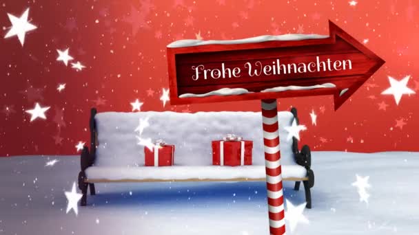 言葉のアニメーションFrohe Weihnachtenは雪の結晶と星が落ちると 赤の背景に雪に覆われたベンチに2つの赤のプレゼントで 赤い木製の矢印記号ボード上の白で書かれています — ストック動画