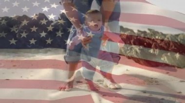 Beyaz bir adamın bir bebeğe yürümesinde yardım ettiğini gösteren Amerikan bayrağı. Amerika Birleşik Devletleri bayrağı ve tatil konsepti dijital kompozisyon