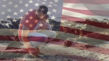 Beyaz bir adamın kucağında bebeğini tutarak çömeldiği Amerikan bayrağının animasyonu. Amerika Birleşik Devletleri bayrağı ve tatil konsepti dijital kompozisyon