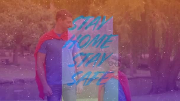 Animación Palabras Stay Home Stay Safe Caucasian Man His Son — Vídeos de Stock