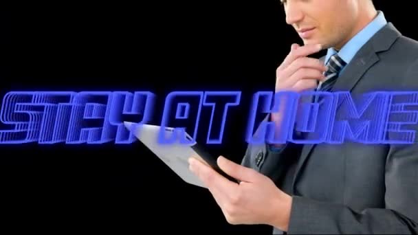 Animation Blue Neon Words Stay Home Caucasian Man Using Tablet — Stock Video