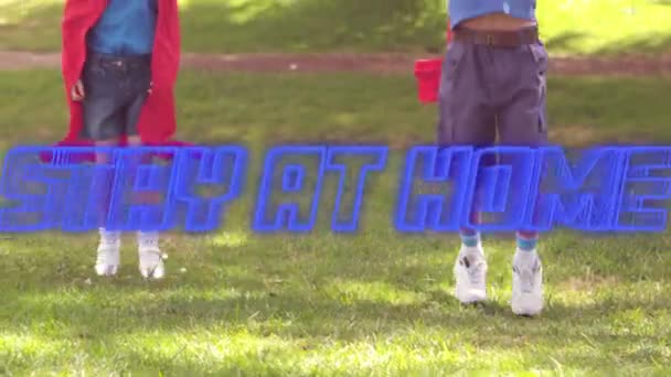 Animation Blue Neon Text Stay Home Caucasian Brothers Φορώντας Κάπες — Αρχείο Βίντεο