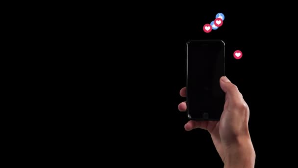 スマートフォンをハートの上で使っている人のアニメーションなど Emojidex 絵文字デックス 黒の背景に浮かぶ — ストック動画