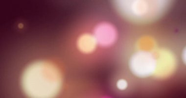 Arka planda hipnotik hareketlerle hareket eden çok renkli ışık noktalarının animasyonu. Işık ve hareket kavramı dijital olarak oluşturuldu.